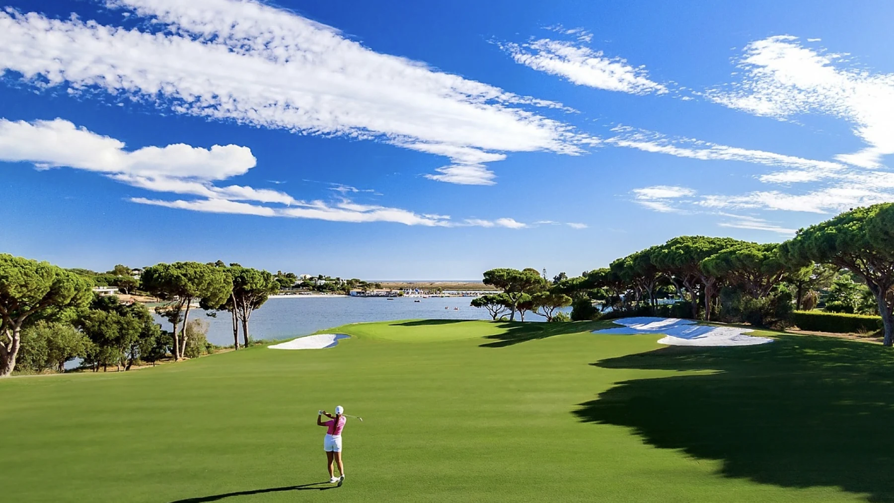 A golfer on Quinta do Lago South overlooking the lake